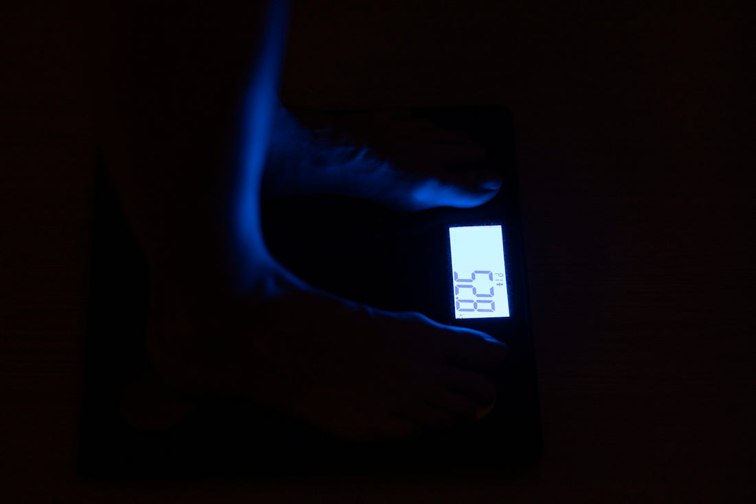 person standing on bathroom scale at 68 4