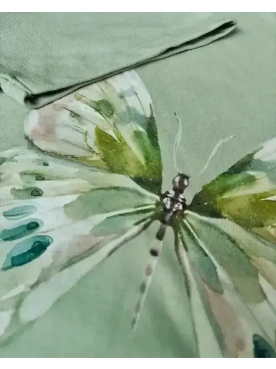 Watercolor butterfly print on soft women's clothing, calm green tones, quiet style for real Indian women