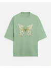 A soft mint green jade butterfly oversized tshirt with a detailed pale yellow and green butterfly graphic by urban theory